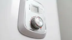 What is the optimal temperature to set on the boiler to save electricity?